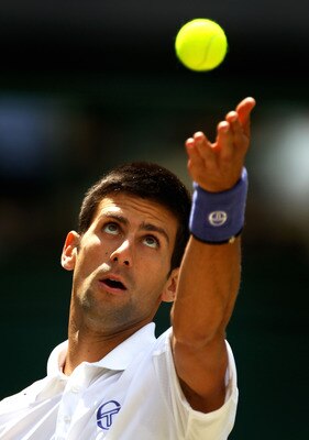 LONDON, ENGLAND - JULY 01:  Novak Djokovic of Serbia serves during his semifinal round match against Jo-Wilfried Tsonga of France on Day Eleven of the Wimbledon Lawn Tennis Championships at the All England Lawn Tennis and Croquet Club on July 1, 2011 in L