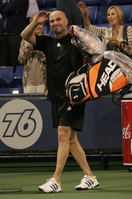 LOS ANGELES, CA - JULY 24:  Andre Agassi smiles and waves to the crowd after his victory against John McEnroe in the Stars Under the Stars gala on July 24, 2010 at the Los Angeles Tennis Center in Los Angeles, California.  Andre Agassi defeated John McEnr