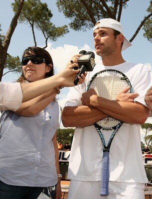 ROME - MAY 07:  Andy Roddick of the USA is asked a question before having a knock about with children at the ATP Masters Series at the Foro Italico, on May 7, 2008 in Rome, Italy.  (Photo by Clive Brunskill/Getty Images)