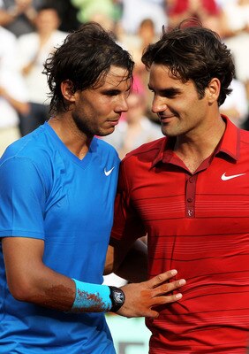 PARIS, FRANCE - JUNE 05:  Rafael Nadal of Spain shakes hands with Roger Federer of Switzerland following his victory during the men's singles final match between Rafael Nadal of Spain and Roger Federer of Switzerland on day fifteen of the French Open at R