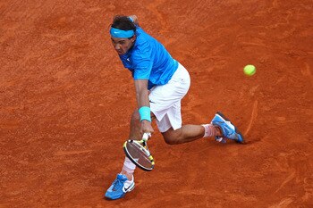 PARIS, FRANCE - JUNE 05:  Rafael Nadal of Spain hits a backhand during the men's singles final match between Rafael Nadal of Spain and Roger Federer of Switzerland on day fifteen of the French Open at Roland Garros on June 5, 2011 in Paris, France.  (Phot