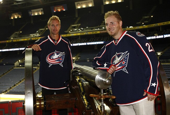 COLUMBUS,OH - JULY 21:  Jeff Carter #7 of the Columbus Blue Jackets and James Wisniewski #21 of the Columbus Blue Jackets pose for the cameras during a press conference on July 21, 2011 at Nationwide Arena in Columbus, Ohio.  (Photo by John Grieshop/Getty