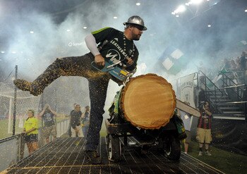 PORTLAND, OR - JULY 30: 'Timber Joey', the mascot of the Portland Timbers, saws off a slab after the Timbers scored a goal during the second half of the game against Toronto FC at Jeld-Wen Field on July 30, 2011 in Portland, Oregon. The game ended in a dr