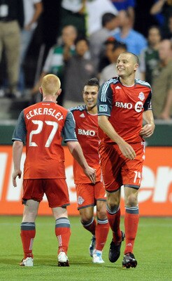 PORTLAND, OR - JULY 30: Danny Koevermans #14 of Toronto FC celebrates with teammates Richard Eckersley #27 and Joao Plata #7 of Toronto FC after scoring a goal during the second half of the game at Jeld-Wen Field on July 30, 2011 in Portland, Oregon.The g