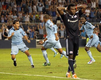 KANSAS CITY, KS - JULY 30:  Teal Bunbury #9 of Sporting Kansas City celebrates with Omar Bravo #99 after scoring a game-tying goal in the 90th minute during the game against the New England Revolution on July 30, 2011 at LiveStrong Sporting Park in Kansas