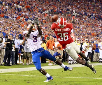 JACKSONVILLE, FL - OCTOBER 30:  Chris Rainey #3 of the Florida Gators attempts to catcha pass against Shawn Williams #36 of the Georgia Bulldogs during the game at EverBank Field on October 30, 2010 in Jacksonville, Florida.  (Photo by Sam Greenwood/Getty