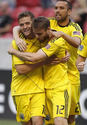 SANDY, UT - JULY 30: Eddie Gaven #12, Robbie Rogers #18 and Rich Balchan #2 of the Columbus Crew celebrate a goal against Real Salt Lake during the first half of an MLS soccer game July 30, 2011 at Rio Tinto Stadium in Sandy, Utah. (Photo by George Frey/G