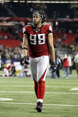 ATLANTA, GA - JANUARY 15:  Jamaal Anderson #98 of the Atlanta Falcons walks off the field after the Falcons lost 48-21 against the Green Bay Packers during their 2011 NFC divisional playoff game at Georgia Dome on January 15, 2011 in Atlanta, Georgia.  (P