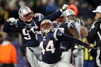 FOXBORO, MA - DECEMBER 06:  (L-R) Jermaine Cunningham #96 and Jarrad Page #44 of the New England Patriots celebrate a defensive stop in the second quarter against the New York Jets at Gillette Stadium on December 6, 2010 in Foxboro, Massachusetts.  (Photo