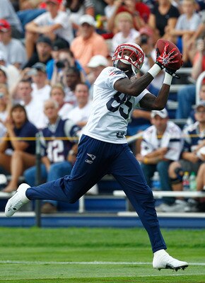 FOXBOROUGH, MA  - JULY 29:  Chad Ochocinco #85 of the New England Patriots catches a pass during the afternoon session of training camp at Gillette Stadium on July 29, 2011 in Foxborough, Massachusetts.  (Photo by Jim Rogash/Getty Images)