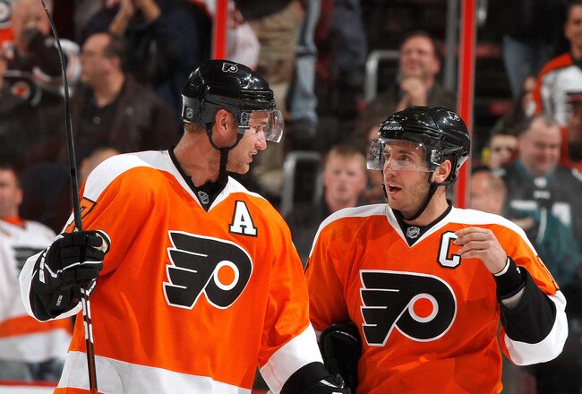 PHILADELPHIA, PA - FEBRUARY 03:  Jeff Carter #17 and Mike Richards #18 of the Philadelphia Flyers talk during a break in action in an NHL hockey game against the Nashville Predators at the Wells Fargo Center on February 3, 2011 in Philadelphia, Pennsylvan