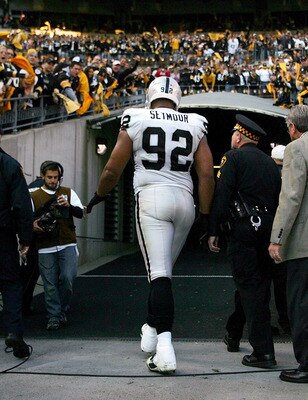 PITTSBURGH, PA - NOVEMBER 21:  Richard Seymour #92 of the Oakland Raiders is escorted out of the stadium after being ejected for hitting Ben Roethlisberger #7 of the Pittsburgh Steelers during the game on November 21, 2010 at Heinz Field in Pittsburgh, Pe