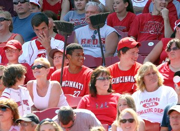 CINCINNATI, OH - JULY 31:  Two fans hold brooms as the Cincinnati Reds won 9-0 to complete a three game sweep of the San Francisco Giants at Great American Ball Park on July 31, 2011 in Cincinnati, Ohio.  (Photo by Andy Lyons/Getty Images)