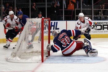 NEW YORK, NY - APRIL 20: Alexander Semin #28 of the Washington Capitals scores a goal in the third period against goalie Henrik Lundqvist #30 of the New York Rangers in Game Four of the Eastern Conference Quarterfinals during the 2011 NHL Stanley Cup Play