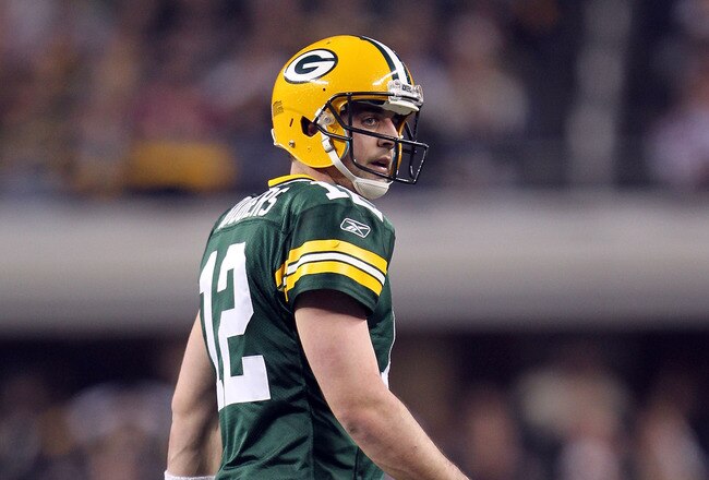 ARLINGTON, TX - FEBRUARY 06:  Quarterback Aaron Rodgers #12 of the Green Bay Packers looks on from the field against the Pittsburgh Steelers during Super Bowl XLV at Cowboys Stadium on February 6, 2011 in Arlington, Texas.  (Photo by Jamie Squire/Getty Im