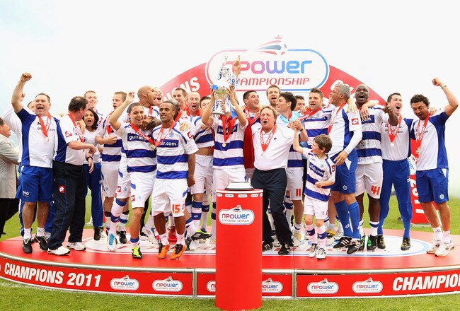 LONDON, ENGLAND - MAY 07:  Queens Park Rangers players celebrates with the trophy after winning the npower Championship match between Queens Park Rangers and Leeds United at Loftus Road on May 7, 2011 in London, England.  (Photo by Ian Walton/Getty Images