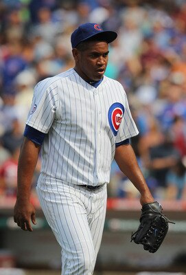 CHICAGO, IL - JULY 15: Carlos Marmol #49 of the Chicago Cubs walks to the dugout after being taken out of the game in the 9th inning with two out against Florida Marlins at Wrigley Field on July 15, 2011 in Chicago, Illlinois. The Cubs defeated the Marlin