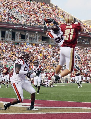 CHESTNUT HILL, MA - SEPTEMBER 25:  Jayron Hosley #20 of the Virginia Tech Hokies intercepts a pass intended for Chris Pantale #81 of the Boston College Eagles as Bruce Taylor #51 of Virginia Tech defends on September 25, 2010 at Alumni Stadium in Chestnut