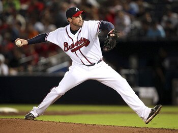 ATLANTA, GA - JULY 28:  Pitcher Derek Lowe #32 of the Atlanta Braves throws a pitch during the game against the Pittsburgh Pirates at Turner Field on July 28, 2011 in Atlanta, Georgia.  (Photo by Mike Zarrilli/Getty Images)