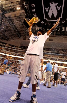 DALLAS, TX - JUNE 16: Guard Jason Terry of the Dallas Mavericks raises the Larry O'Brien Trophy for fans during the Dallas Mavericks Victory celebration on June 16, 2011 in Dallas, Texas. (Photo by Brandon Wade/Getty Images)
