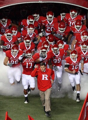 PISCATAWAY, NJ - NOVEMBER 12:  Head coach Greg Schiano of the Rutgers Scarlet Knights leads his team on the field to play against the South Florida Bulls at Rutgers Stadium on November 12, 2009 in Piscataway, New Jersey.  (Photo by Jim McIsaac/Getty Image