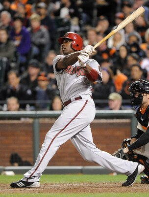SAN FRANCISCO, CA - AUGUST 2: Justin Upton #10 of the Arizona Diamondbacks swings and watches the flight of his ball as he hits a two-run home run against the San Francisco Giants in the eighth inning  during an MLB baseball game at AT&T Park August 2, 20