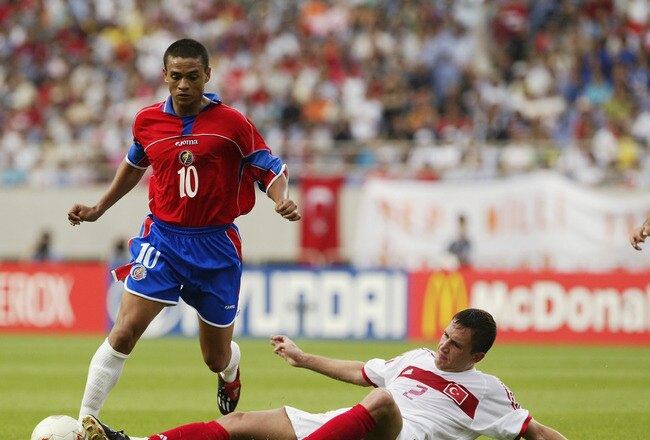 INCHEON - JUNE 9:  Walter Centeno of Costa Rica is tackled by Emre Asik of Turkey during the FIFA World Cup Finals 2002 Group C match played at the Incheon Munhak Stadium, in Incheon, South Korea on June 9, 2002. The match ended in a 1-1 draw. DIGITAL IMA