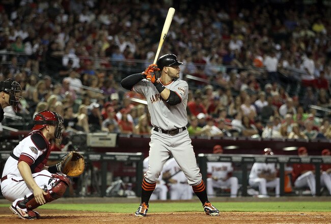 PHOENIX, AZ - JUNE 14:  Cody Ross #13 of the San Francisco Giants bats against the Arizona Diamondbacks during the Major League Baseball game at Chase Field on June 14, 2011 in Phoenix, Arizona. The Giants defeated the Diamondbacks 6-5.  (Photo by Christi