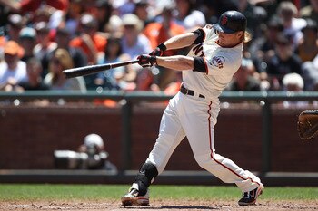 SAN FRANCISCO, CA - JULY 24:  Mike Fontenot #14 of the San Francisco Giants hits an RBI sacrafice fly in the fourth inning against the Milwaukee Brewers at AT&T Park on July 24, 2011 in San Francisco, California.  (Photo by Jed Jacobsohn/Getty Images)