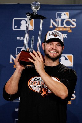 PHILADELPHIA - OCTOBER 23:  Cody Ross #13 of the San Francisco Giants celebrates with the NCLS MVP trophy after defeating the Philadelphia Phillies 3-2 and winning the pennant in Game Six of the NLCS during the 2010 MLB Playoffs at Citizens Bank Park on O