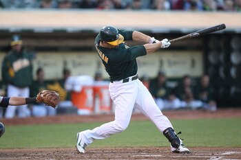 OAKLAND, CA - JULY 29:  Josh Willingham #16 of the Oakland Athletics hits a two run home run against the Minnesota Twins at O.co Coliseum on July 29, 2011 in Oakland, California.  (Photo by Jed Jacobsohn/Getty Images)