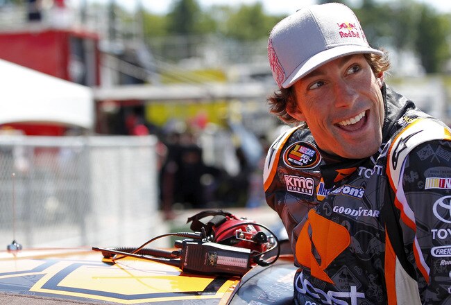 LOUDON, NH - JULY 14:  Travis Pastrana, driver of the #99 Boost Mobile/PWR Toyota, climbs into his car during practice for the NASCAR K&N Pro Series East New England 125 at New Hampshire Motor Speedway on July 14, 2011 in Loudon, New Hampshire.  (Photo by