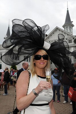LOUISVILLE, KY - MAY 07:  Cressida Meier looks on wearing her derby hat in the paddock area during the 137th Kentucky Derby at Churchill Downs on May 7, 2011 in Louisville, Kentucky.  (Photo by Harry How/Getty Images)
