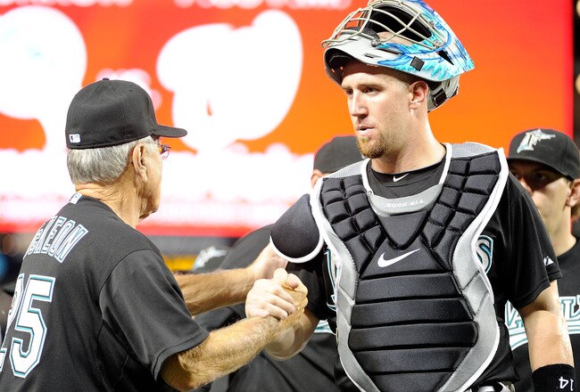 WASHINGTON, DC - JULY 26:  John Buck #14 of the Florida Marlins celebrates with manager Jack McKeon #25 after a 11-2 victory against the Washington Nationals at Nationals Park on July 26, 2011 in Washington, DC.  (Photo by Greg Fiume/Getty Images)