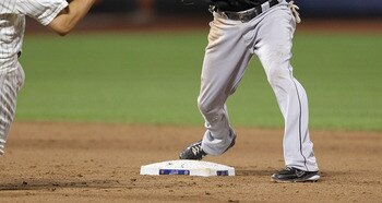 NEW YORK, NY - AUGUST 02: Emilio Bonifacio #1 of the Florida Marlins turns a double play in the ninth inning as Jonathon Niese #49 of the New York Mets slides into base at Citi Field on August 2, 2011 in the Flushing neighborhood of the Queens borough of 