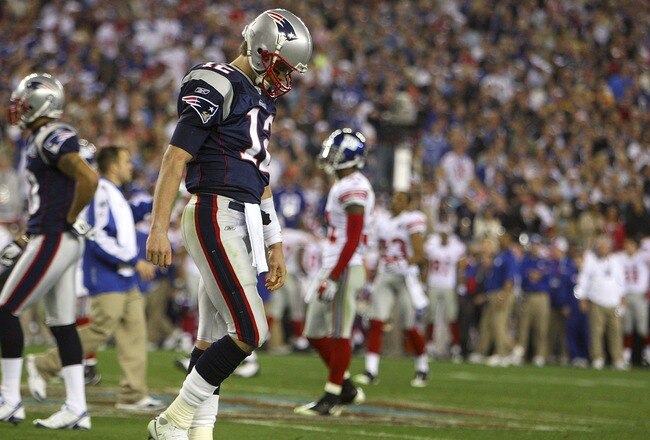 GLENDALE, AZ - FEBRUARY 03:  Quarterback Tom Brady #12 of the New England Patriots walks off the field after losing to the New York Giants 17-14 in Super Bowl XLII on February 3, 2008 at the University of Phoenix Stadium in Glendale, Arizona.  (Photo by D