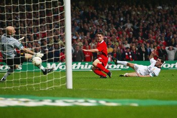 CARDIFF - MARCH 2:  Michael Owen of Liverpool scores the second goal during the Worthington Cup Final between Liverpool and Manchester United held on March 2, 2003 at the Millennium Stadium, in Cardiff, Wales. Liverpool won the match and final 2-0. (Photo