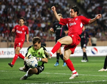 MONTE CARLO, MONACO - AUGUST 26:  Luis Garcia of Liverpool is beaten to the ball by Igor Akinfeev of CSKA Moscow during the UEFA Super Cup match between Liverpool and CSKA Moscow at the Stade Louis II on August 26, 2005 in Monte Carlo, Monaco.  (Photo by