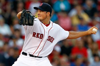 BOSTON, MA - AUGUST 4:  Erik Bedard #23 of the Boston Red Sox throws against the Cleveland Indians at Fenway Park on August 4, 2011 in Boston, Massachusetts.  (Photo by Jim Rogash/Getty Images)