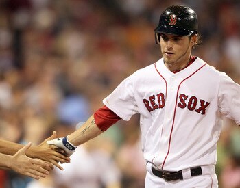 BOSTON, MA - JULY 07:  Josh Reddick #16 of the Boston Red Sox is congratulated after his solo home run in the seventh inning against the Baltimore Orioles on July 7, 2011 at Fenway Park in Boston, Massachusetts.  (Photo by Elsa/Getty Images)