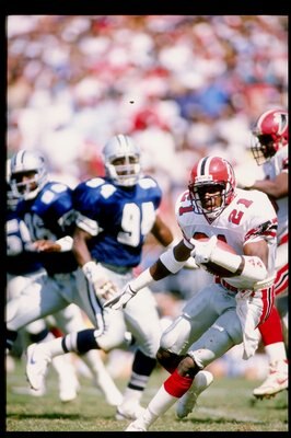 1989:  Defensive back Deion Sanders of the Atlanta Falcons runs with the football during a game against the Dallas Cowboys at Fulton County Stadium in Atlanta, Georgia.  The Falcons won the game 27-21. Mandatory Credit: Allen Steele  /Allsport