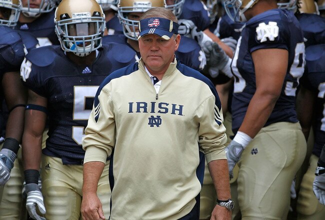SOUTH BEND, IN - SEPTEMBER 11: Head coach Brian Kelly of the Notre Dame Fighting Irish waits to enter the field with his team before a game against the Michigan Wolverines at Notre Dame Stadium on September 11, 2010 in South Bend, Indiana. Michigan defeat