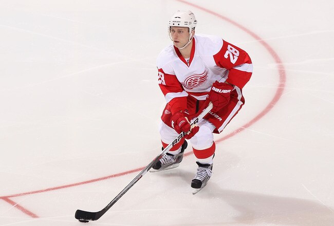 GLENDALE, AZ - APRIL 18:  Brian Rafalski #28 of the Detroit Red Wings skates with the puck in Game Three of the Western Conference Quarterfinals against the Phoenix Coyotes during the 2011 NHL Stanley Cup Playoffs at Jobing.com Arena on April 18, 2011 in