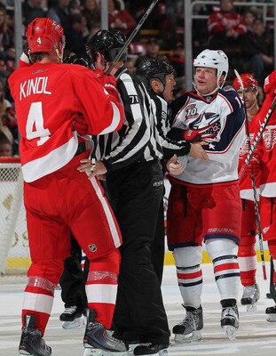 DETROIT, MI - FEBRUARY 4:  Derek Dorsett #15 of the Columbus Blue Jackets has a few choice words for Jakub Kindl #4 of the Detroit Red Wings in a game on February 4, 2011 at the Joe Louis Arena in Detroit, Michigan. (Photo by Claus Andersen/Getty Images)