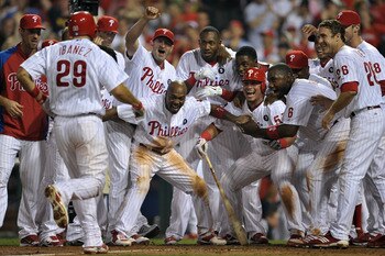 PHILADELPHIA, PA - JULY 08: The Philadelphia Phillies wait at home plate for teammate Raul Ibanez #29 after he hit a walk-off home run in the bottom of the 10th inning to beat the Atlanta Braves 3-2 at Citizens Bank Park on July 8, 2011 in Philadelphia, P