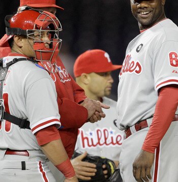 WASHINGTON, DC - APRIL 12: Carlos Ruiz #51 of the Philadelphia Phillies and teammates Ryan Howard #6 and Wilson Valdez #21 during a pitching change against the Washington Nationals at Nationals Park on April 12, 2011 in Washington, DC. (Photo by Rob Carr/