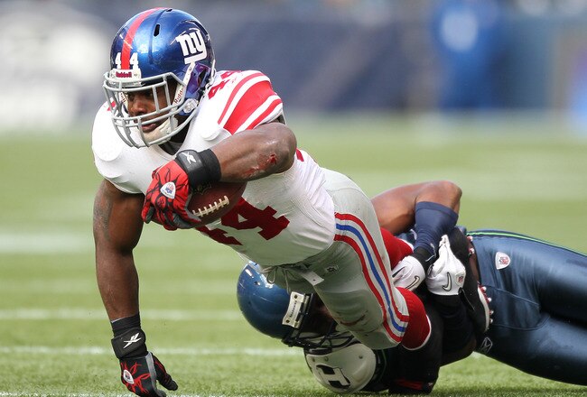 SEATTLE - NOVEMBER 07:  Running back Ahmad Bradshaw #44 of the New York Giants rushes against the Seattle Seahawks at Qwest Field on November 7, 2010 in Seattle, Washington. The Giants defeated the Seahawks 41-7. (Photo by Otto Greule Jr/Getty Images)