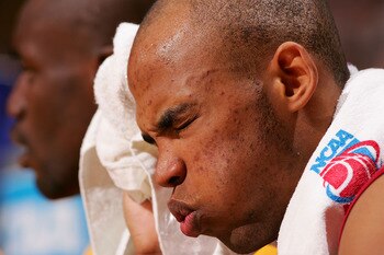 SPOKANE, WA - MARCH 18:  Taj Gibson #22 of the USC Trojans grimaces in pain on the bench after taking a hard foul during the second round of the NCAA Men's Basketball Tournament against the Texas Longhorns at Spokane Memorial Arena on March 18, 2007 in Sp