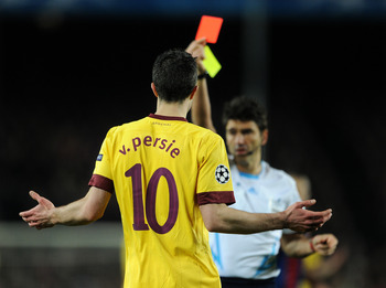 BARCELONA, SPAIN - MARCH 08: Robin van Persie of Arsenal reacts as referee Massimo Busacca shows his a red card during the UEFA Champions League round of 16 second leg match between Barcelona and Arsenal on March 8, 2011 in Barcelona, Spain. (Photo by J