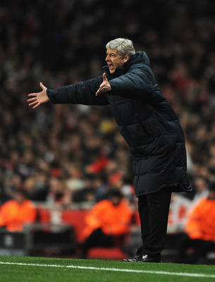 LONDON, ENGLAND - FEBRUARY 16: Arsene Wenger, Manager of Arsenal shows his frustration during the UEFA Champions League round of 16 first leg match between Arsenal and Barcelona at the Emirates Stadium on February 16, 2011 in London, England. (Photo by